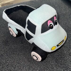 White Plush Toy Truck with Pink Eyes and Bright Yellow Smile for Grill